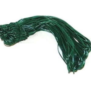 May include: A roll of green floral wire, used for arranging flowers and crafts.