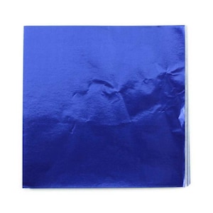 May include: A sheet of blue metallic foil paper. The paper has a wrinkled texture.