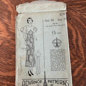 May include: Vintage Advance Patterns sewing pattern envelope. The envelope is off-white with illustrations of a dress and text. The text includes "Bust 36", "Size 18", and "15 cents". The pattern is for a women's frock.