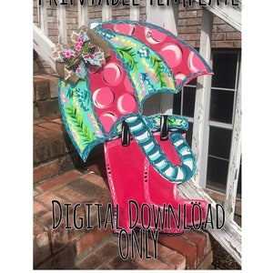 May include: A wooden, hand-painted rain boot and umbrella template. The umbrella is pink with white circles and teal accents. The rain boot is bright pink. The text "PRINTABLE TEMPLATE" and "DIGITAL DOWNLOAD ONLY" are visible.