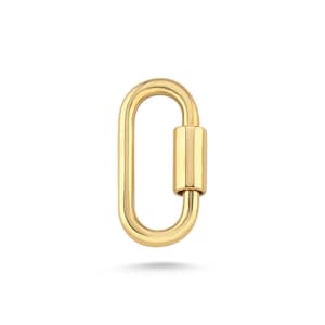 May include: A gold-colored oval-shaped clasp with a cylindrical locking mechanism. The clasp is a bright, shiny gold and is set against a white background. The design is simple and elegant, suitable for jewelry or accessories.