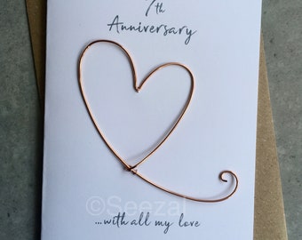 Biglietto ricordo per il 7° anniversario di matrimonio, con cuore in filo di rame. Regalo tradizionale per 7 anni di matrimonio. Formato A6: 15x10,5 cm.
