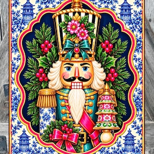 May include: A rectangular wall art print featuring a central nutcracker figure with a black and white striped hat, teal uniform, and white beard. The nutcracker is surrounded by pine branches, red berries, and a blue and white floral border.