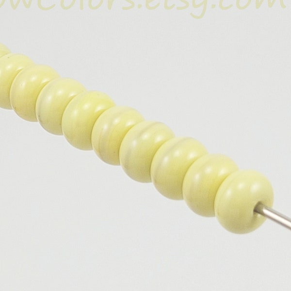 Streaky pale yellow rondelles - soft creamy pastel color with hints of green. SRA handmade lampwork glass beads, 10 mm. Ready to ship.