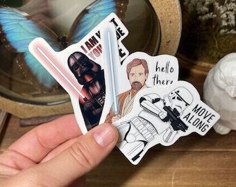 May include: Three Star Wars themed stickers. The first sticker features Darth Vader with the text "I am your father". The second sticker features Obi-Wan Kenobi with the text "hello there". The third sticker features a Stormtrooper with the text "move along".
