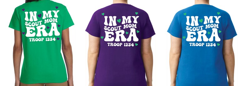 May include: Three t-shirts with the text "IN MY SCOUT MOM ERA" and "TROOP 1234" printed on the back. The shirts are green, purple, and blue.