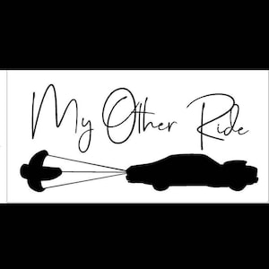 May include: Black and white silhouette of a person being towed behind a car with the text "My Other Ride".
