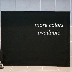 May include: Black fireplace screen with the text "more colours available" in white.