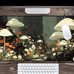 May include: A rectangular mouse pad featuring a whimsical forest scene with large mushrooms, orange and white flowers, and a path. A white mouse rests on the pad. The color palette includes greens, browns, and off-white.