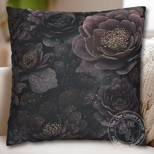 May include: Square decorative pillow featuring a dark floral design. The pillow has a black background with large, stylized flowers in shades of dark purple and gold. The flowers have detailed petals and a textured appearance.