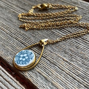 Blue Corelle- Broken Dishes Necklace - Old Town Blue Corelle set in a gold stainless steel setting on a 24” stainless steel chain.