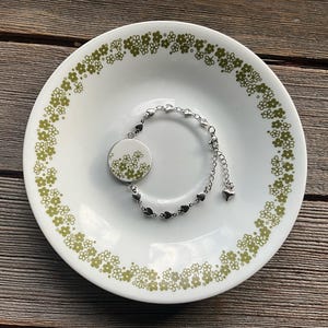 Large Crazy Daisy - bracelet. Stainless steel dangly style bracelet with 1” Spring Blossom Corelle broken china setting - pyrex jewelry