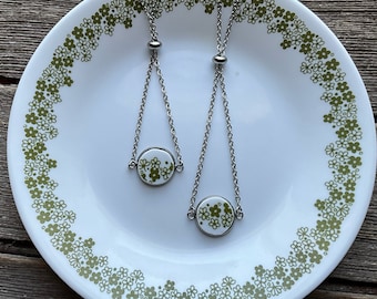 Crazy Daisy - slider bracelet broken china bracelet. Stainless steel dangly style. .75” (19mm) spring blossom/gold or silver stainless steel