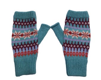 May include: A pair of teal blue fingerless gloves with a colorful geometric pattern. The pattern includes shades of pink, red, white, and purple.