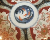 A decorative Imari style colourful vintage bevelled edge Japanese effect plate