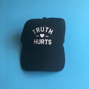 Truth Hurts Dad Hat by Fashionisgreat - Pink Khaki White Black