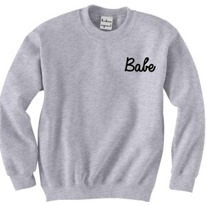 Babe Pocket Unisex Sweatshirt by Fashionisgreat