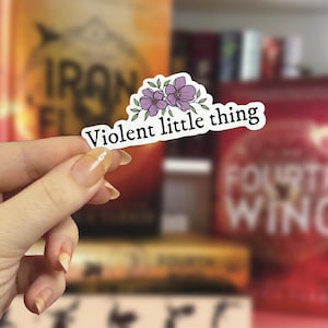 May include: A sticker with a floral design and the text "Violent little thing".