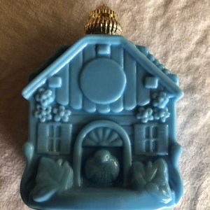 Vtg Blue Avon bottle with cottage and bird