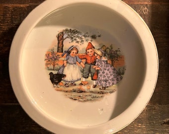 Antique early children and chickens bowl