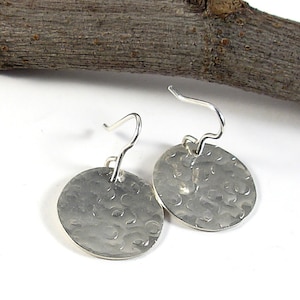 Tiny sterling silver hammered earrings. Flat round textured earrings for her. Small circle earring