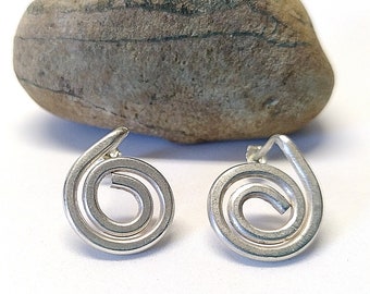 Handmade silver spiral earrings for women. Artisanal stud sterling silver earrings. Silver jewelry.