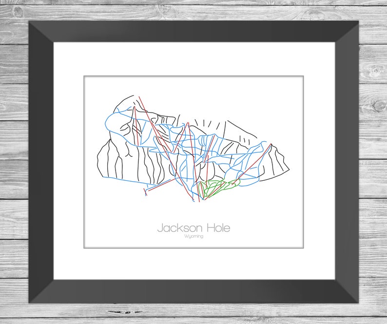 May include: A black and white line art map of the Jackson Hole ski resort in Wyoming. The map shows the different ski runs and lifts. The text "Jackson Hole" and "Wyoming" is printed below the map.