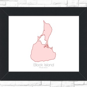 May include: A black framed print of a pink outline of Block Island, Rhode Island. The island is outlined in red.