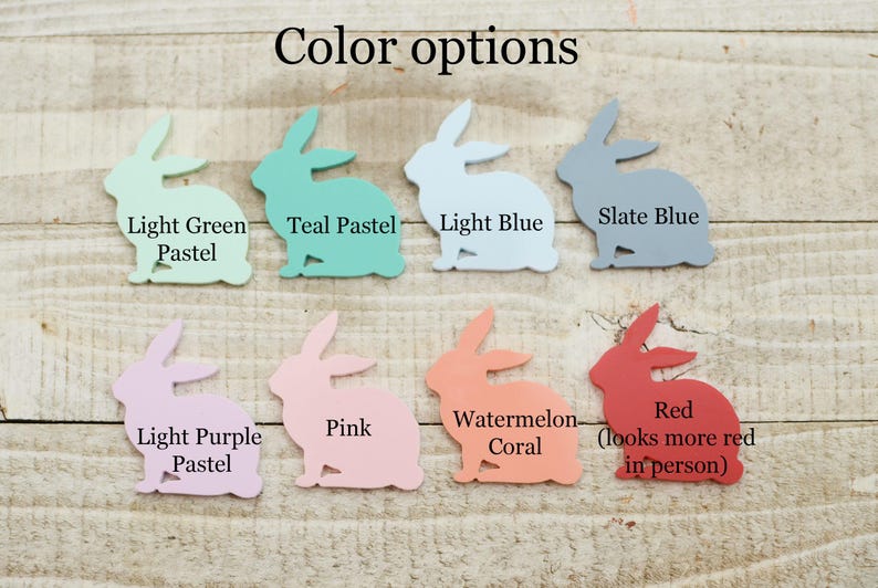May include: A collection of bunny-shaped cutouts in various pastel colors, including light green, teal, light blue, slate blue, light purple, pink, watermelon coral, and red. The text "Color options" is at the top.