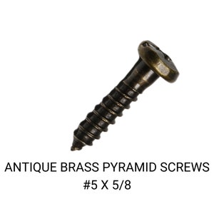 May include: Antique brass pyramid screws, #5 x 5/8 inch. The screws have a dark brown finish and a pyramid-shaped head.