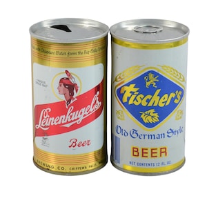 May include: Two vintage beer cans. One is white with a red banner and the text "Leinenkugel's Beer". The other is white with a blue and gold diamond shape and the text "Fischer's Old German Style BEER".