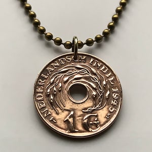 May include: A gold necklace with a 1945 Dutch East Indies 1 cent coin pendant. The coin has a hole in the centre and features a design of a wreath of leaves.