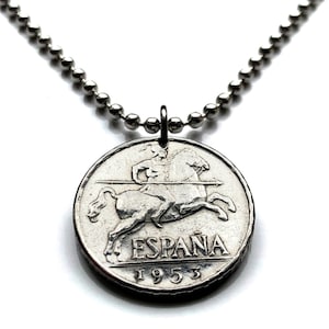 May include: Silver necklace with a Spanish coin pendant featuring a rider on horseback and the text "ESPAÑA 1953".