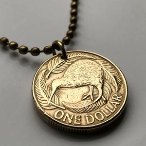 2002 Nouvelle-Zélande Pendentif en pièce de 1 dollar oiseau kiwi Wellington Maori Île du Pacifique Océanie Hawaiki britannique Île du Nord et du Sud haka n001336
