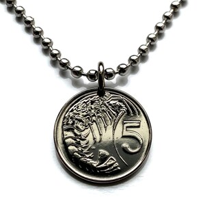 May include: A silver chain necklace with a silver pendant featuring a 5 Australian dollar coin with a lobster design.