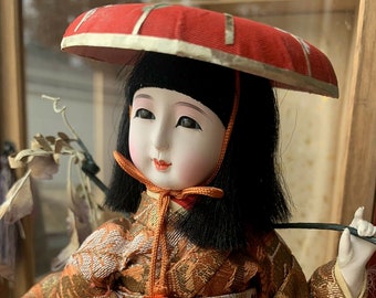 oriental dolls in glass cases