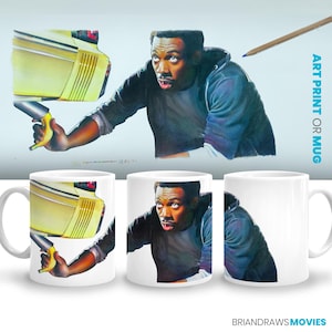 May include: A white ceramic mug with a colorful illustration of a man in a black jacket holding a yellow banana. The mug has a black handle and the text "BrianDrawsMovies" is printed on the bottom.