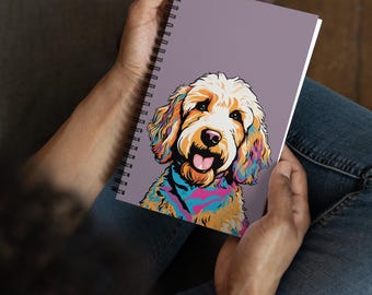 May include: A spiral bound notebook with a colorful illustration of a doodle dog on a purple background.
