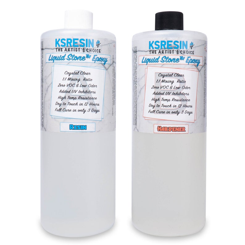 May include: Two clear plastic bottles labelled "KSRESIN" with the text "The Artist's Choice Liquid Stone Epoxy". The bottle on the left is labelled "Resin" and the bottle on the right is labelled "Hardener". Both bottles have a white background with black text and a blue and white marble pattern.