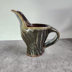 Vintage Handmade 5&quot; Pottery Creamer In Olive Green And Brown with Heavy Glaze