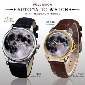 May include: Two automatic watches with full moon faces. One has a 42 mm silver tone case and black leather straps. The other has a 38 mm two-tone case and brown leather straps. The watches have manual winding.