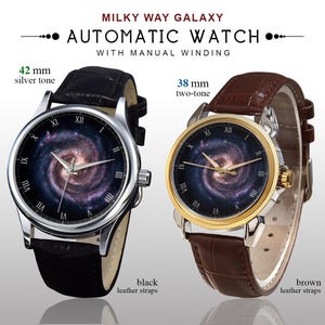 May include: Two automatic watches with manual winding. One has a 42 mm silver tone case and black leather straps. The other has a 38 mm two-tone case and brown leather straps. Both watches feature a galaxy design on the watch face.