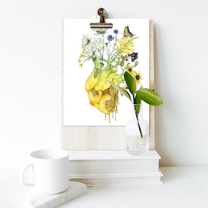 May include: A watercolor painting of a human heart with flowers growing out of it. The heart is dripping with honey. The flowers are yellow, white, blue, and purple. There is a butterfly on the flowers.