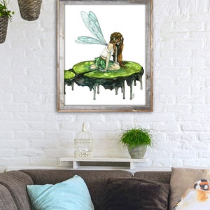 May include: A watercolor painting of a fairy with green wings sitting on a green lily pad. The lily pad is dripping with water. The background is white.