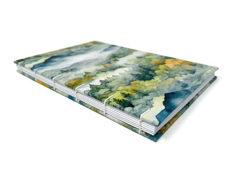 DOT GRID journal notebook. Lays flat with dot grid pages, plus a pocket. TERA