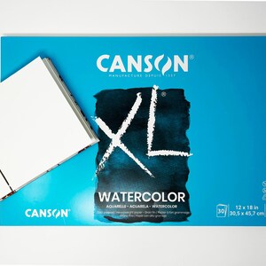 May include: A blue pad of Canson XL Watercolor paper. The pad is 12 by 18 inches and weighs 140 pounds. The paper is acid-free, cold-pressed, and has a smooth finish.