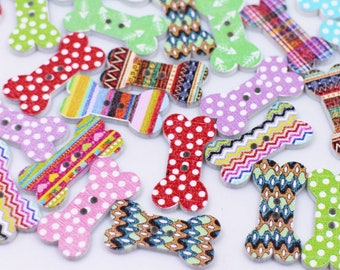 May include: Assortment of colorful wooden bone-shaped buttons with various patterns, including polka dots, stripes, and geometric designs.