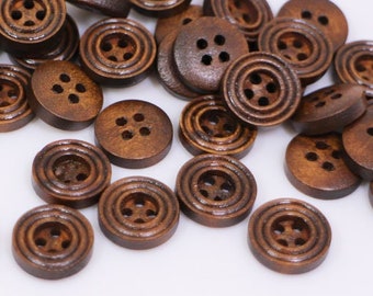 May include: A pile of brown wooden buttons with four holes each. The buttons are arranged in a random pattern and are all the same size.