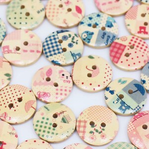 May include: Assortment of colourful wooden buttons with various patchwork designs. The buttons feature different patterns, including floral, geometric, and polka dots.