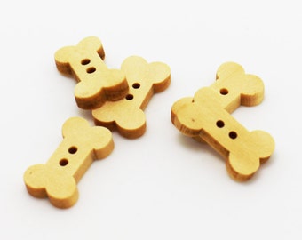 May include: Four wooden bone-shaped buttons with two holes each. The buttons are light brown and have a smooth finish.